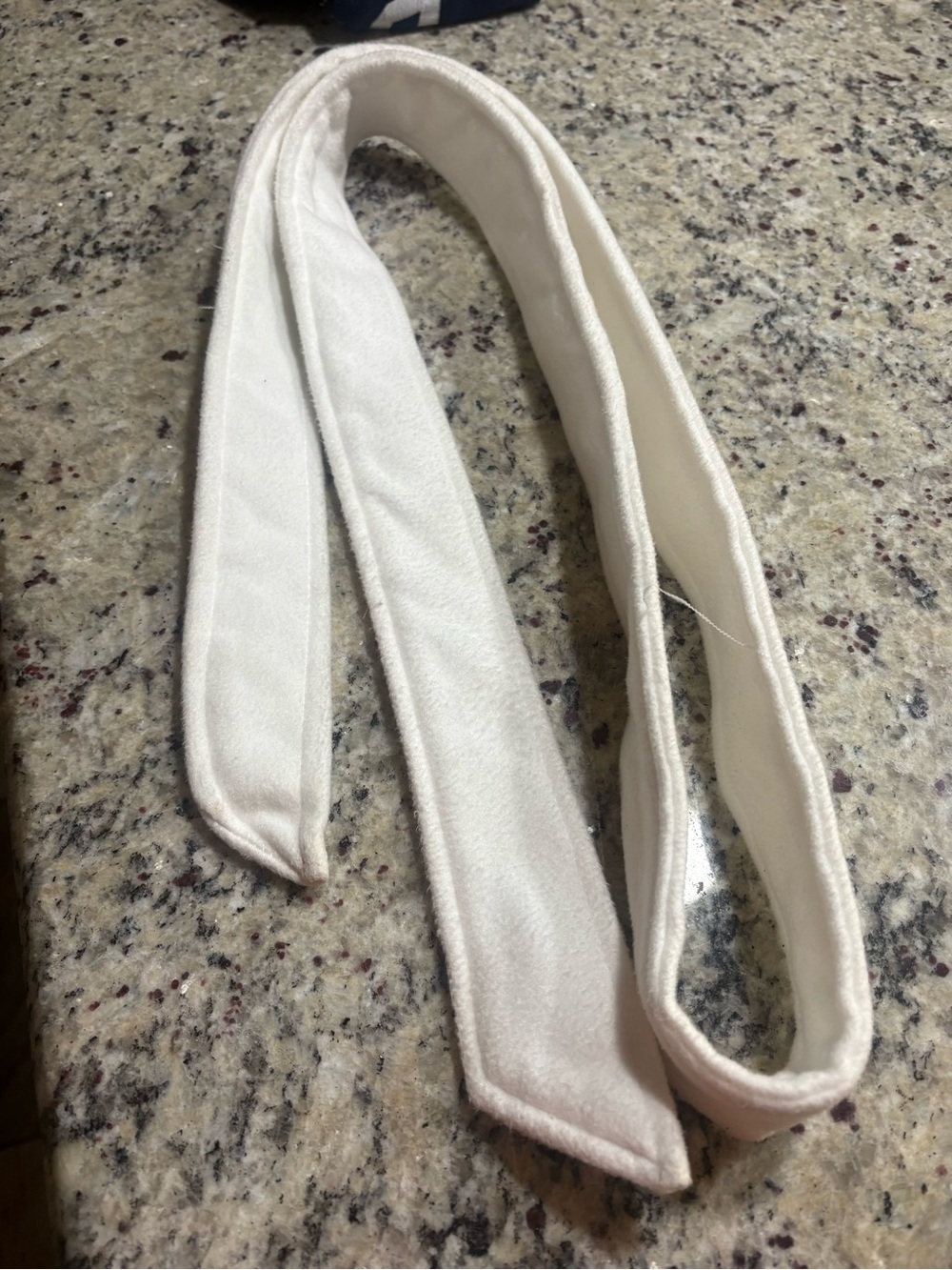 Off white fabric belt for a woman’s  jacket in extra large GUC with some discolo